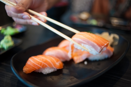 Close up of Salmon Sushi Set on Black Dishの写真素材