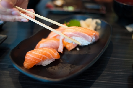 Close up of Salmon Sushi Set on Black Dishの写真素材