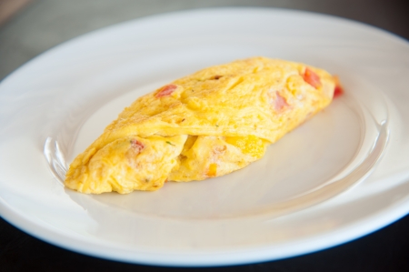 Omelete egg on white dishの写真素材