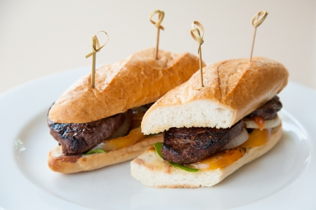Beef steak sandwich on white plateの写真素材