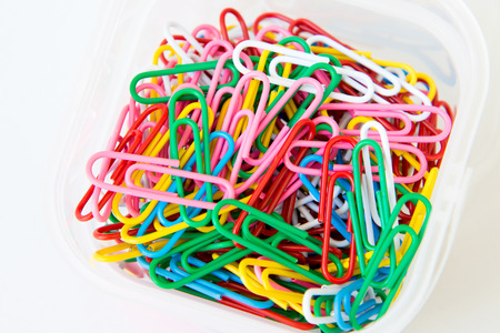variety of colorful paper clips on white backgroundの写真素材