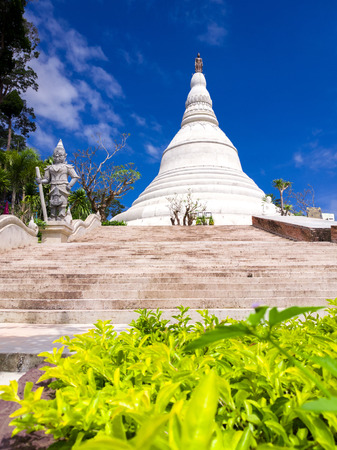 Beautiful Thai temple, pagoda and giant statue with blue sky in Northeast of Thailandの写真素材
