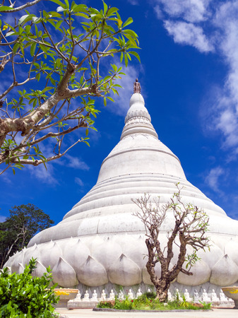 Beautiful Thai temple, pagoda and giant statue with blue sky in Northeast of Thailandの写真素材