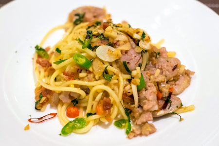 tasty hot and spicy spaghetti with cream, cheese and parsley close upの写真素材