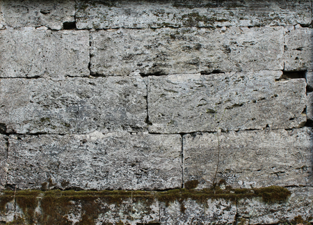 The texture of the stones in the blank stone wall that separates the park Sylvia in the Gatchina park.の写真素材