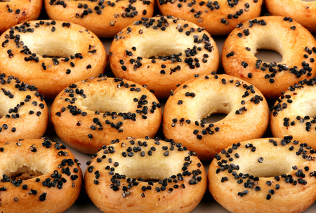 Set of mini ring-shaped cracknels with poppy on the white plateの写真素材