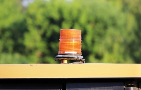 lantern on the roof of the yellow building bulldozerの写真素材