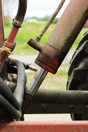 hydraulic piston and hydraulic tubes to the tractor for irrigation water streets in the Gatchina, Leningrad regionの写真素材