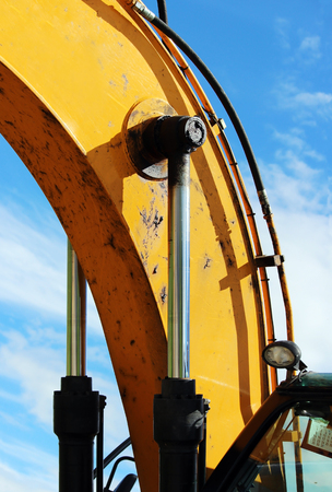 isolated steel hydraulic piston to crane, which lifts and lowers the concrete slab during repair workの写真素材