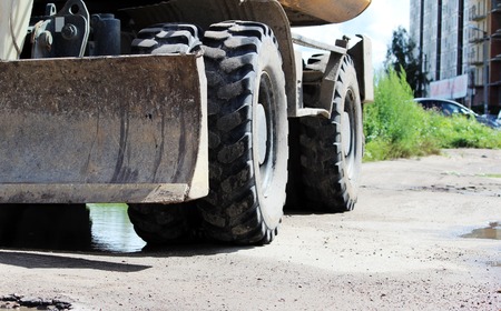 blade in the bulldozer and ground for construction work on the roadの写真素材