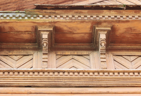 artsy decor trim and classic old wooden house. triangular patterns and wood texture brick colorの写真素材