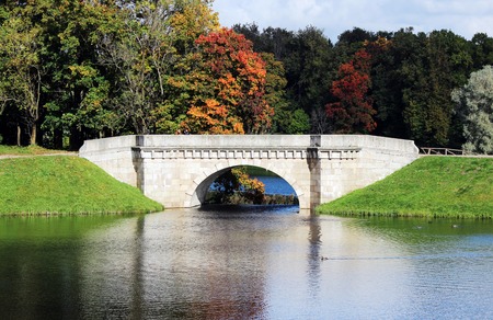 Karpin bridge - a bridge that connects the island in Gatchina. Located on an artificial cascade between Karpin pond and the White Lake.の写真素材