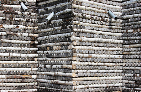 texture of birch logs stacked pattern on the walls of the house.の写真素材