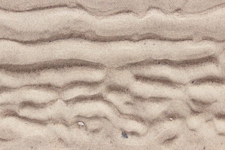 texture of sand on the banks of the river from the shoreline after the tideの写真素材
