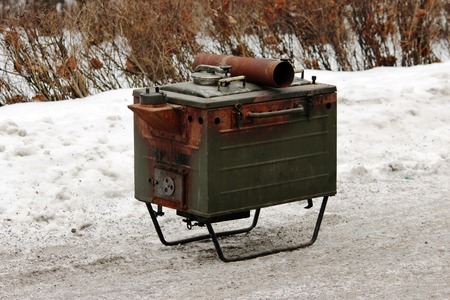 military soldier hunting metal stationary kitchen for preparing outdoor mealsの写真素材
