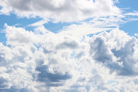 white clouds against a blue sky summer day.の写真素材