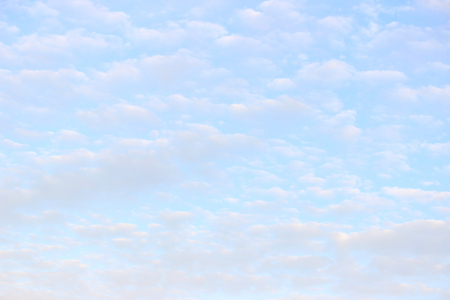 white clouds against a blue sky summer day.の写真素材