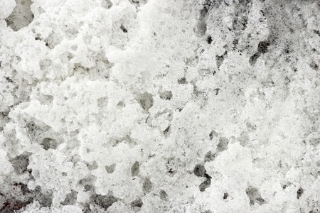 river thick white foam was frozen in the frosty air in autumnの写真素材