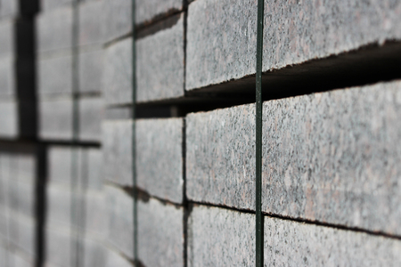 many curbs for construction works on pallets at the  site  laying paving slabs  city square.の写真素材