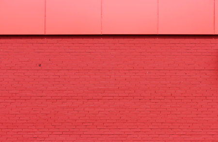 texture of bright red brick wall on a sunny day