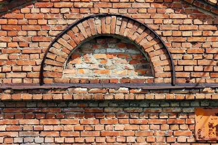 texture semi-circular window in the old historic brick buildingの写真素材