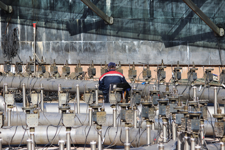 A worker prepares a fountain for the opening in the spring, St. Petersburg.の写真素材