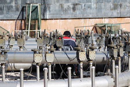 A worker prepares a fountain for the opening in the spring, St. Petersburg.の写真素材