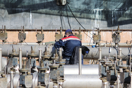 A worker prepares a fountain for the opening in the spring, St. Petersburg.の写真素材