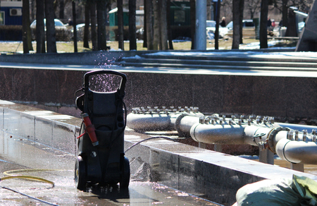 Portable press for washing stands next to the fountain in the spring, St. Petersburg.の写真素材