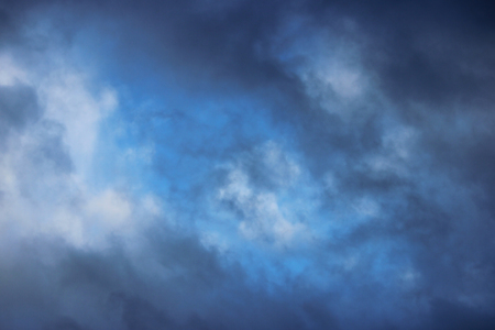 Huge white cumulus clouds against blue sky in springの写真素材
