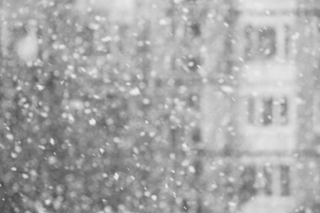 Black and white Falling snow flakes during the snowfall from the skyの写真素材