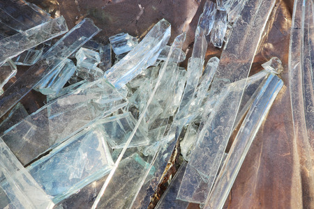 Vandals smashed the glass windows of the unfinished unguarded abandoned building of the shopping complexの写真素材