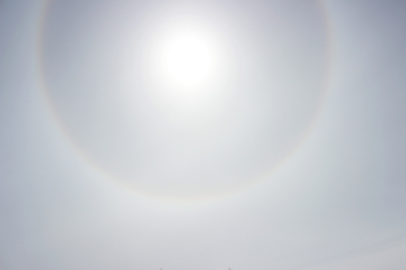 Halo a rainbow around the sun in the afternoon before the weather worsensの写真素材