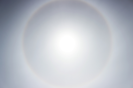 Halo a rainbow around the sun in the afternoon before the weather worsensの写真素材