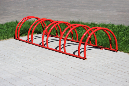 the urban landscape red ring low parking space for bicycles.の写真素材