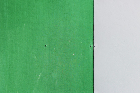 The wall of the house, trimmed with colorful panels, painted in bright colors. Green and beigeの写真素材