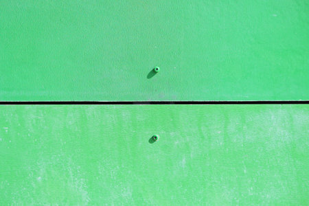 The wall of the house, trimmed with colorful panels, painted in bright colors. Green colorの写真素材