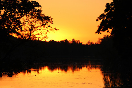 A beautiful sunset on the White Lake in Gatchina Park.の写真素材