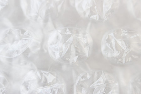 Macro shot of transparent cellophane with pimples. Packaging material and remedy for depression
