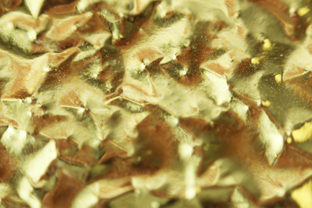 Macro photo of gold foil from packaging of Chinese tea.の写真素材