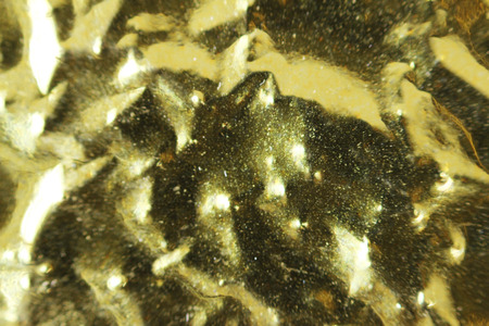 Macro photo of gold foil from packaging of Chinese tea.の写真素材