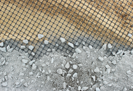 The construction of the Parking for coaches, laying of geomesh on soil before the asphalt pavement, Russia.の写真素材