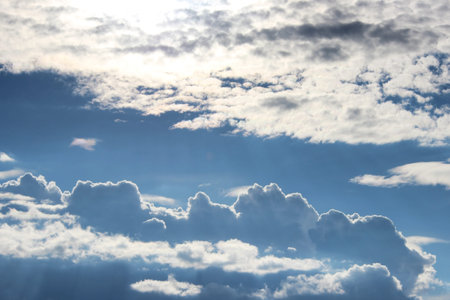 white clouds against the blue sky on a sunny summer day