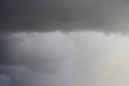Upcoming front from dark gray rain clouds before a thunderstorm in summer