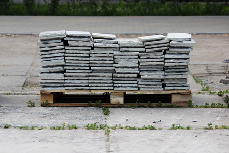 The old tile removed from the walls of the cinema lies on a wooden pallet, waiting for the restoration of the building.の写真素材