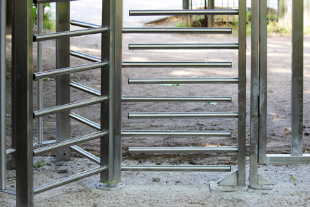 The turnstile full-height rotor electromechanical is installed at the entrance to the Gatchina Park to control and limit the travel of bicycles.の写真素材