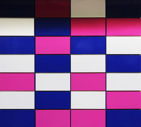 colorful white, crimson and purple rectangular panels on the wall of the houseの写真素材