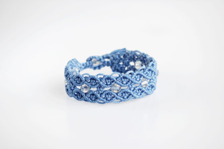blue bracelet for the hand from waxed thread, and transparent plastic beads in the technique of...