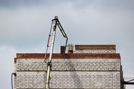 solution to a brick building under construction when the concrete mixture is pouredの写真素材