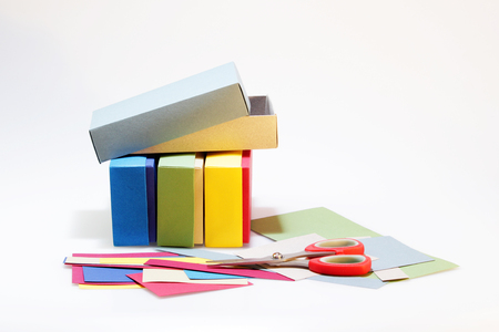 Few colorful paper boxes of colored cardboard for packing bow ties and other gifts on a white background. Hand madeの写真素材